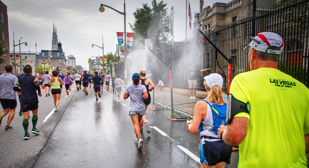 large crowd of people running a marathon